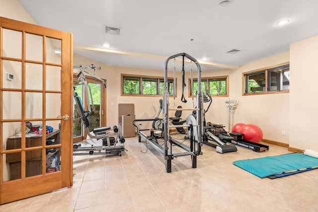 exercise area with visible vents, recessed lighting, and baseboards