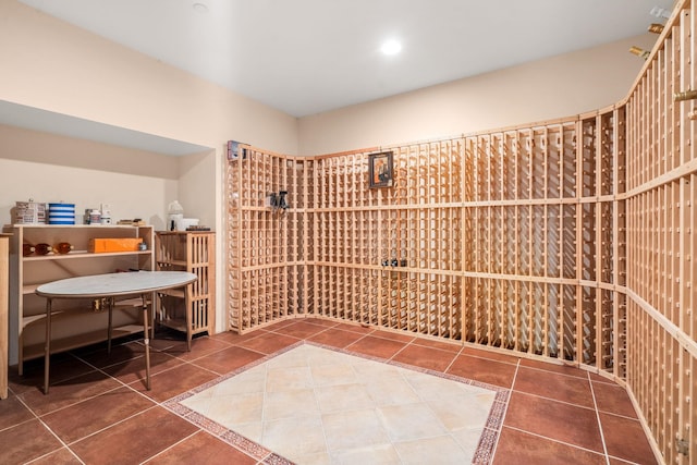 wine area with tile patterned floors and recessed lighting