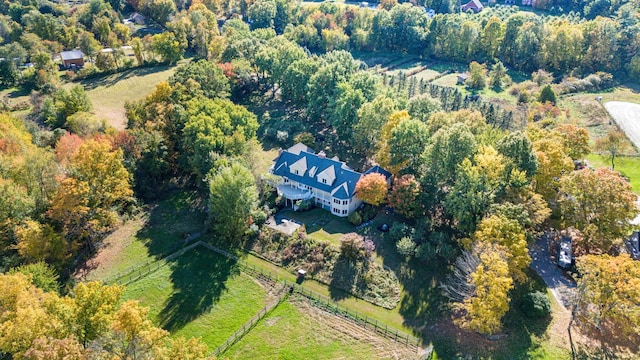 bird's eye view featuring a wooded view