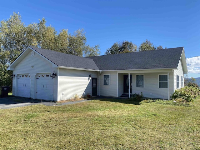 single story home featuring a front yard and a garage