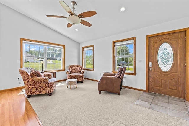 entrance foyer with hardwood / wood-style flooring, vaulted ceiling, a wealth of natural light, and ceiling fan