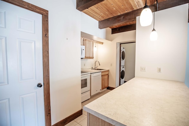 kitchen with white appliances, wooden ceiling, stacked washer and clothes dryer, hanging light fixtures, and beamed ceiling