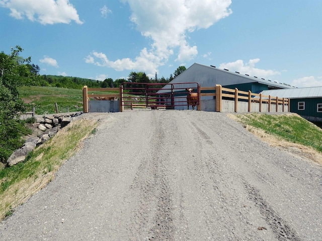 exterior space with an outbuilding and a rural view