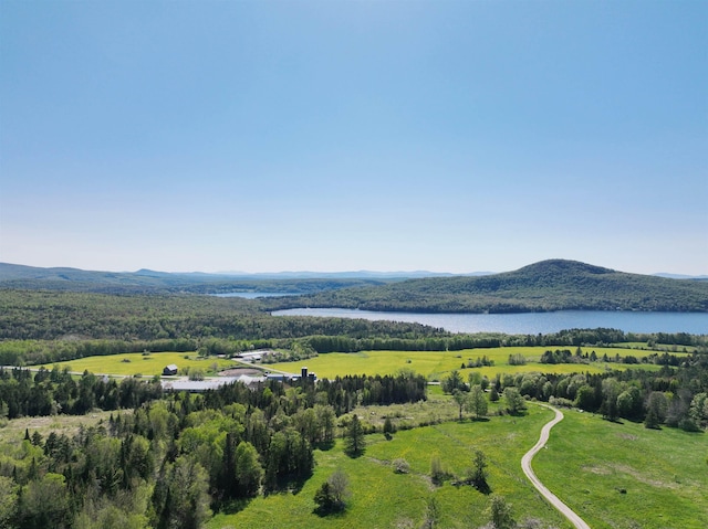 aerial view featuring a water and mountain view