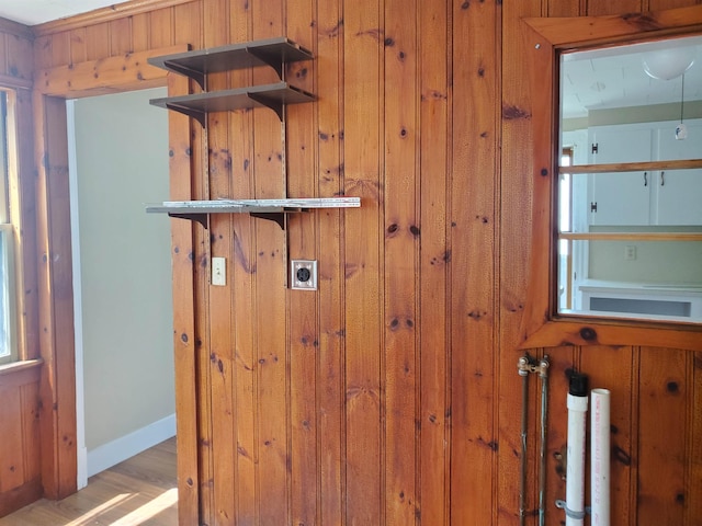 room details with hardwood / wood-style flooring and wooden walls