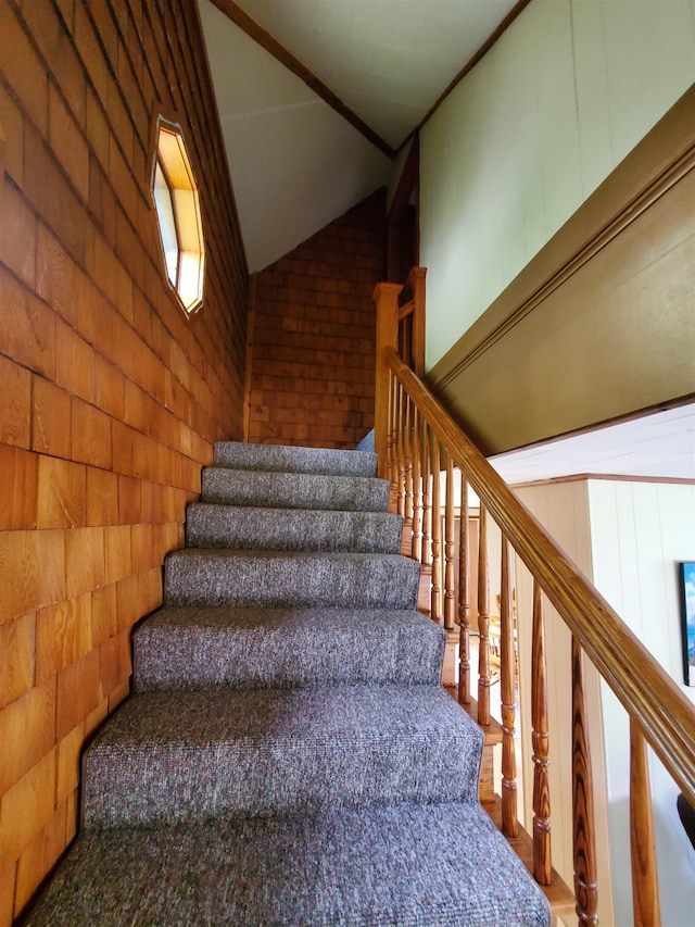 stairs featuring lofted ceiling