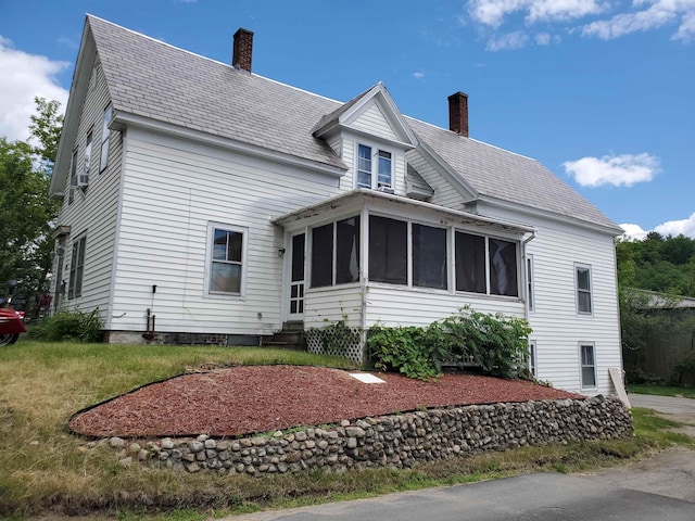 view of front facade featuring a sunroom