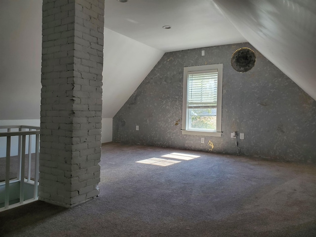 bonus room featuring carpet flooring and vaulted ceiling