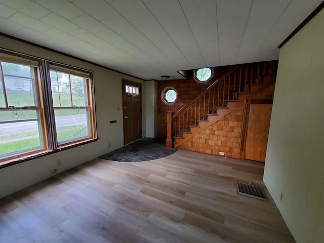 foyer entrance with light wood-type flooring