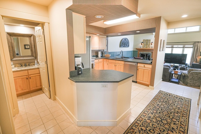 kitchen with kitchen peninsula, stainless steel dishwasher, sink, light brown cabinets, and light tile patterned flooring