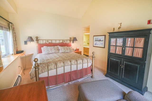 carpeted bedroom featuring a baseboard radiator and vaulted ceiling