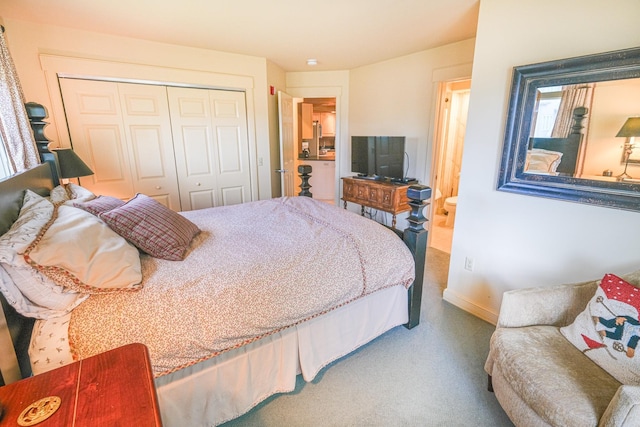 bedroom with a closet and carpet