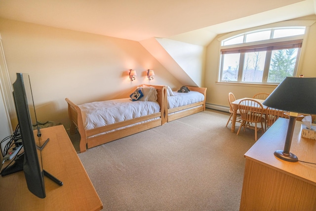 carpeted bedroom with lofted ceiling and a baseboard heating unit