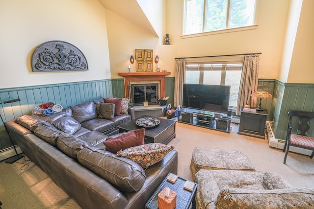 carpeted living room with high vaulted ceiling