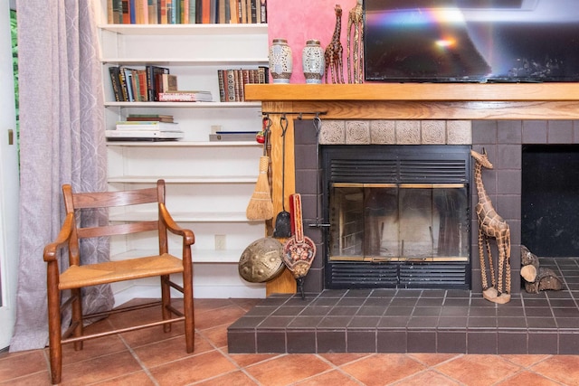 interior details with a tiled fireplace