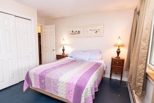 bedroom with a baseboard radiator and a closet