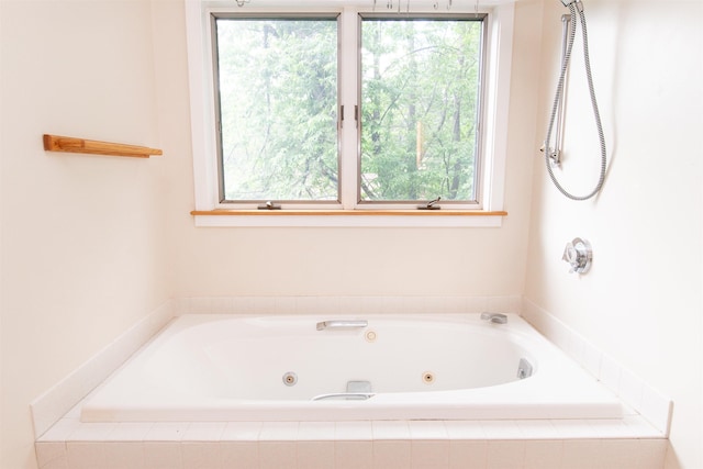 bathroom with tiled bath