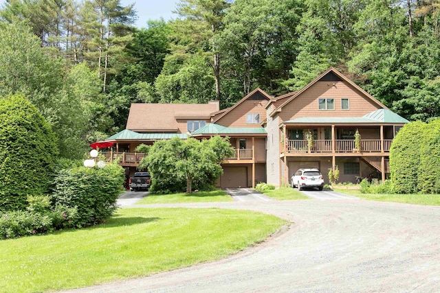 log home with a garage and a front lawn