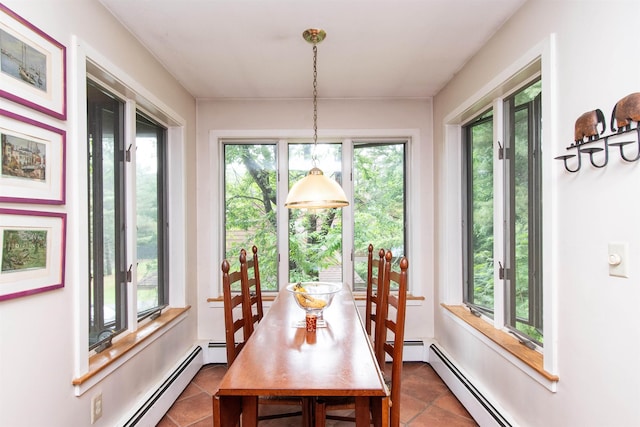 tiled dining room featuring a baseboard heating unit and a wealth of natural light