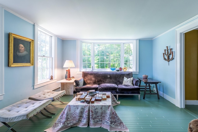 living room with a healthy amount of sunlight, wood finished floors, baseboards, and ornamental molding