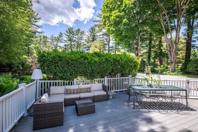 wooden deck featuring outdoor dining area and an outdoor hangout area