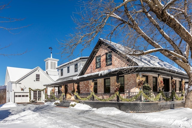 view of front of home with a garage and covered porch