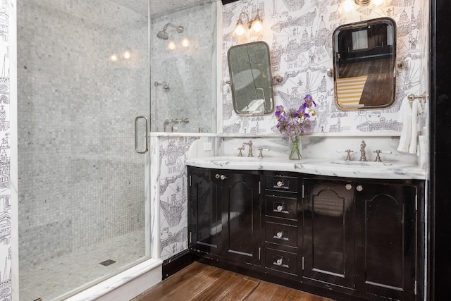 bathroom with vanity, wood-type flooring, and walk in shower