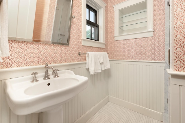 bathroom with sink and tile patterned flooring