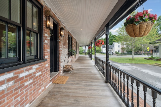 wooden terrace with a porch