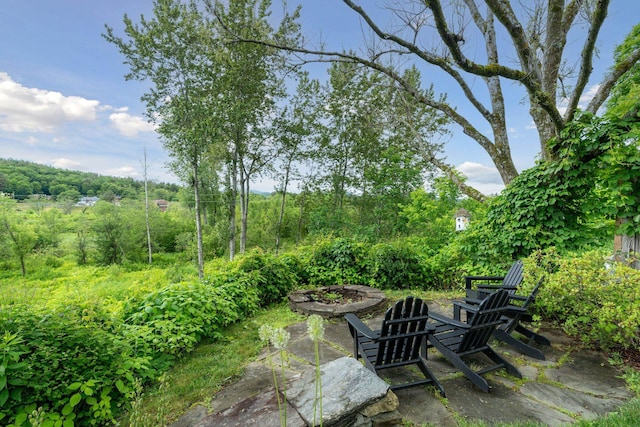 view of patio / terrace featuring a fire pit