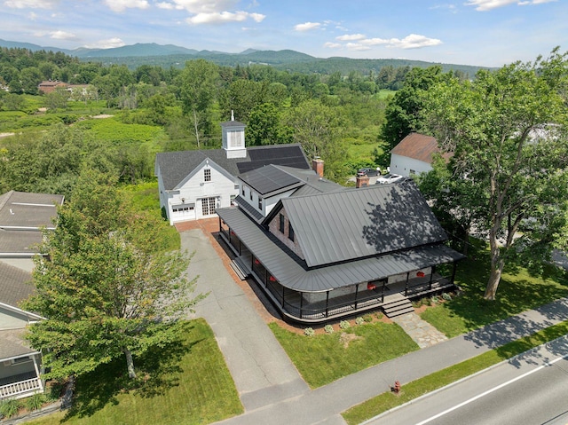 birds eye view of property with a mountain view