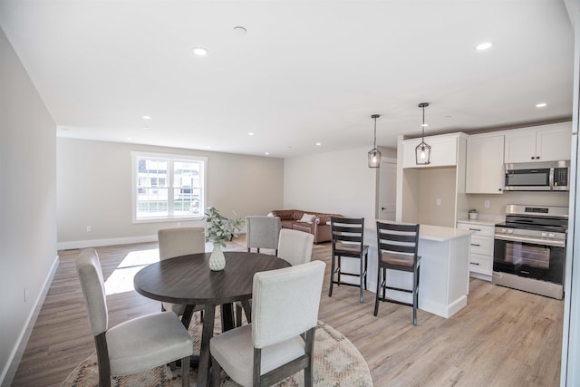 dining space featuring light hardwood / wood-style flooring