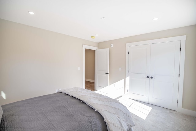 carpeted bedroom featuring a closet