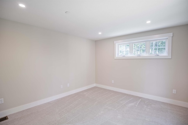 unfurnished room featuring carpet floors