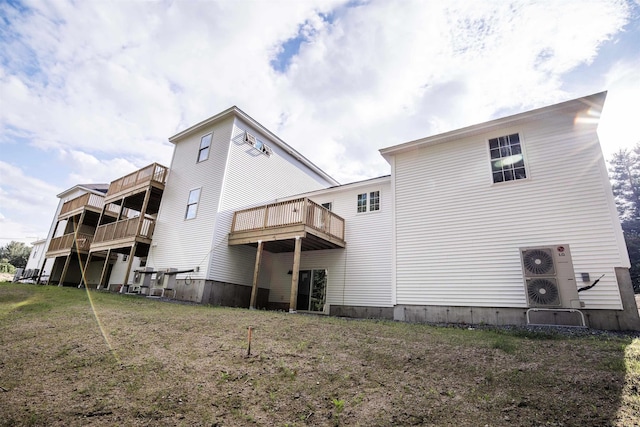 rear view of house with a lawn