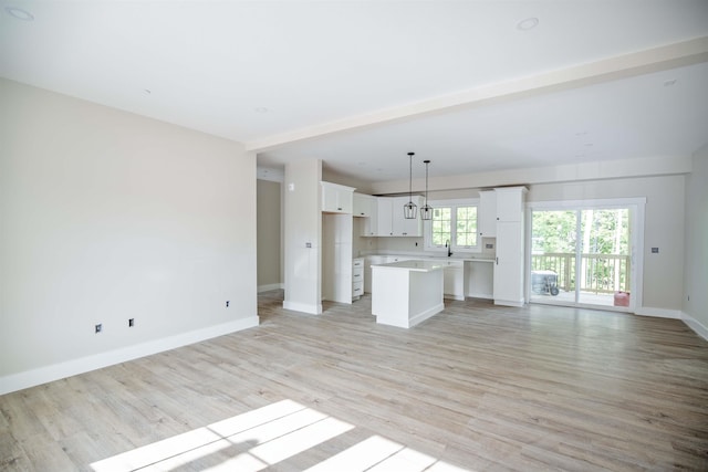 unfurnished living room featuring light hardwood / wood-style flooring