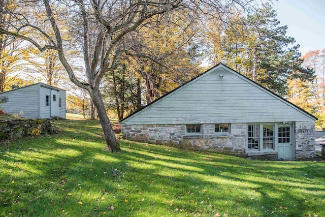 view of home's exterior with a lawn