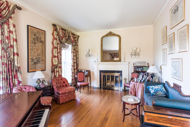 living room featuring hardwood / wood-style flooring and ornamental molding