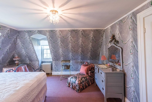 carpeted bedroom with crown molding and radiator