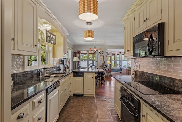 kitchen with sink, hanging light fixtures, kitchen peninsula, black appliances, and ornamental molding