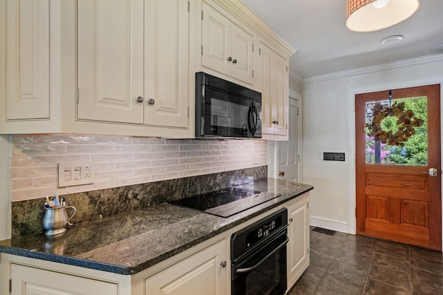 kitchen with dark stone counters, tasteful backsplash, crown molding, and black appliances