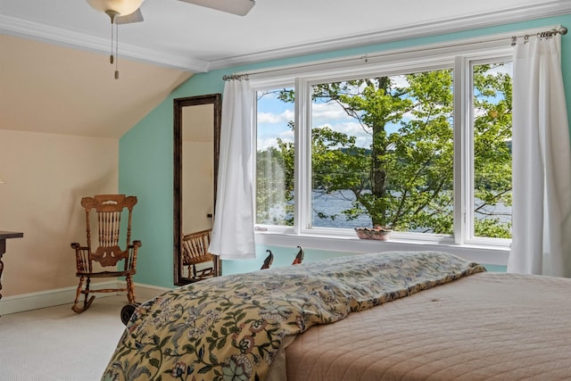 bedroom with carpet flooring, ceiling fan, vaulted ceiling, and ornamental molding