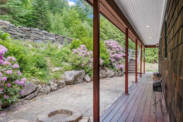 wooden terrace featuring stairs