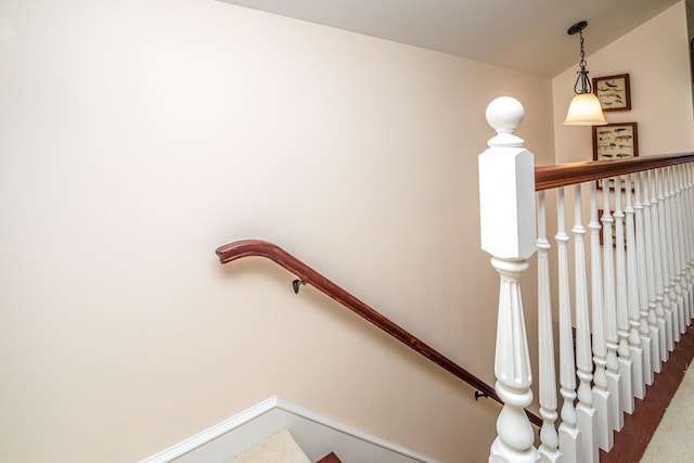 975 Westside Lake Rd, Maidstone, VT 05905 - stairs with vaulted ceiling, carpet flooring, and baseboards