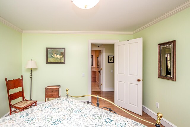 975 Westside Lake Rd, Maidstone, VT 05905 - bedroom with ornamental molding, wood finished floors, and baseboards