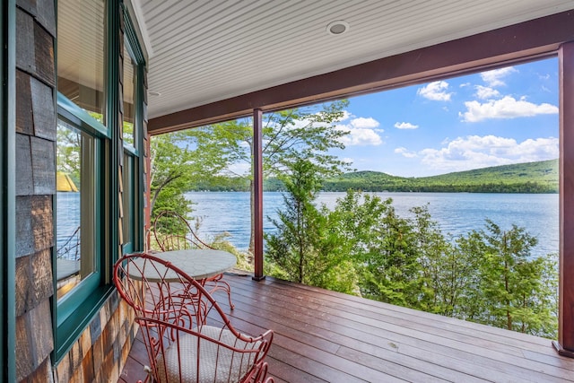 wooden terrace with a water view