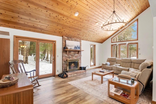 living room with wooden ceiling, a fireplace, high vaulted ceiling, and light wood-style floors