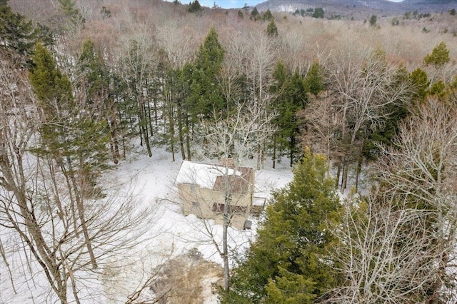 aerial view with a wooded view and a mountain view