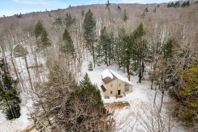 drone / aerial view featuring a forest view