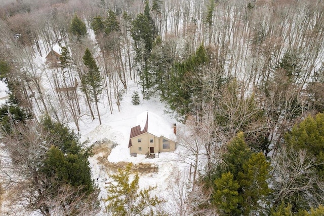 birds eye view of property featuring a view of trees